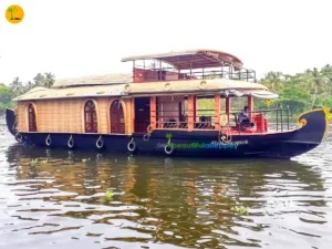 Deluxe houseboat cruising through the Alleppey backwaters in Kerala